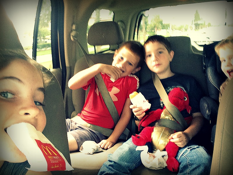 From left, Sarah, Luke, Jack, and Blake enjoy a car ride and some hash browns. Photo by Malia Powers