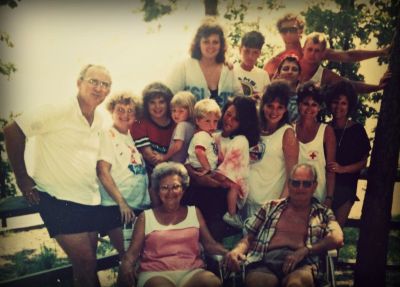 The Neel Family, circa 1989.  Nanny and Pawpaw sit in front, just happy as pie.  Heather is in the front middle, holding her cousin. Behind her are her sister and mom, along with the rest of the Neel cousins, aunts, and uncle. Photo courtesy Heather Harrison.